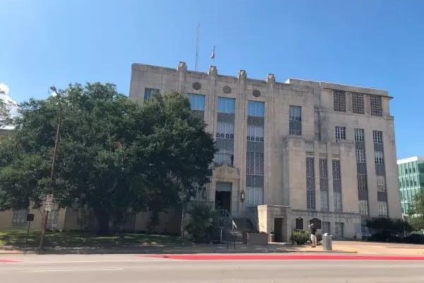 Facade of a large, historic government building.