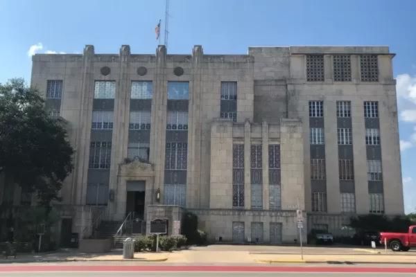 Facade of a large, historic government building.
