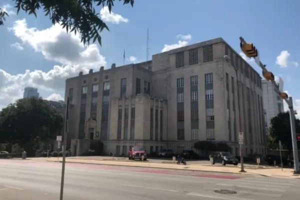 Facade of a large, historic government building.